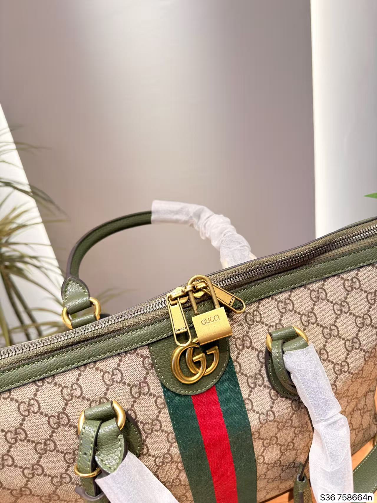 GUCCI プリント入りトラベルバッグ【50％割引+送料無料】