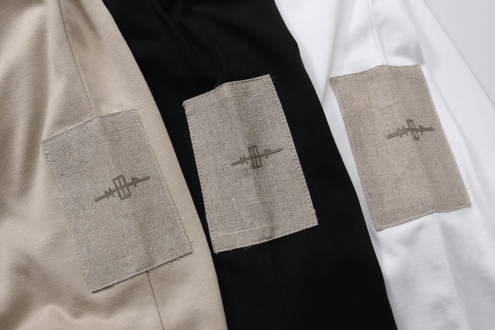 62#MADNESS 十周年限定 纯色贴标T恤 短袖 男女同款 白色 黑色 杏色