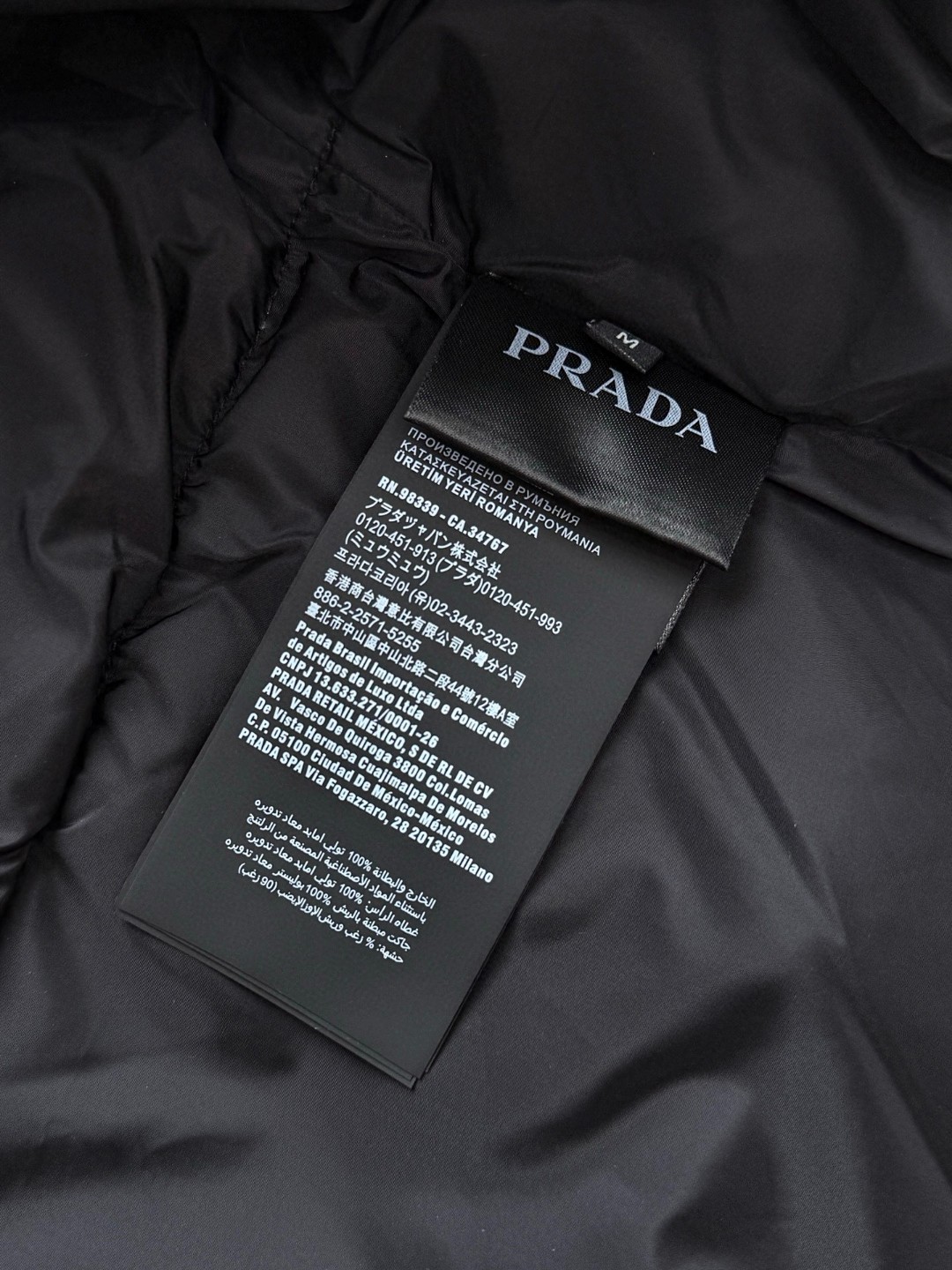 PRADA 普拉达 Re Nylon 拼接尼龙三角标羽绒服 夹克 外套 长袖 黑色 E2 SGC584-1WQ8-F0002-S-OOO