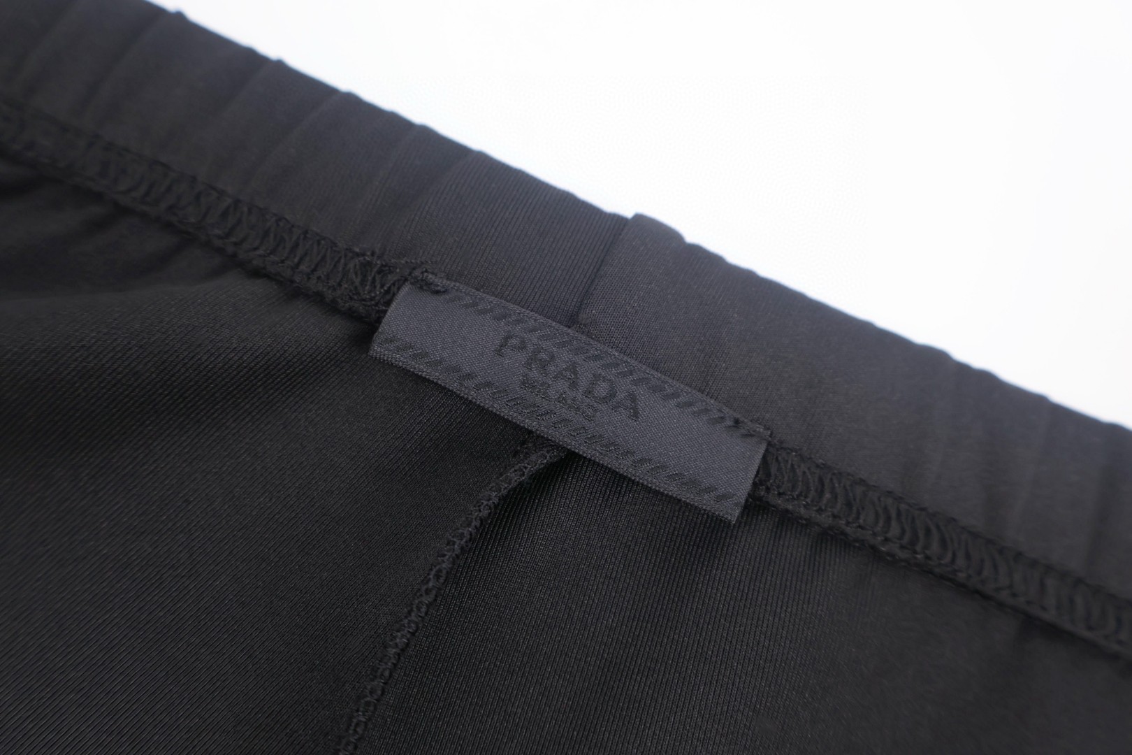 PRADA 普拉达 小logo刺绣松紧腰运动裤 休闲裤 裤子 长裤 黑色 B0