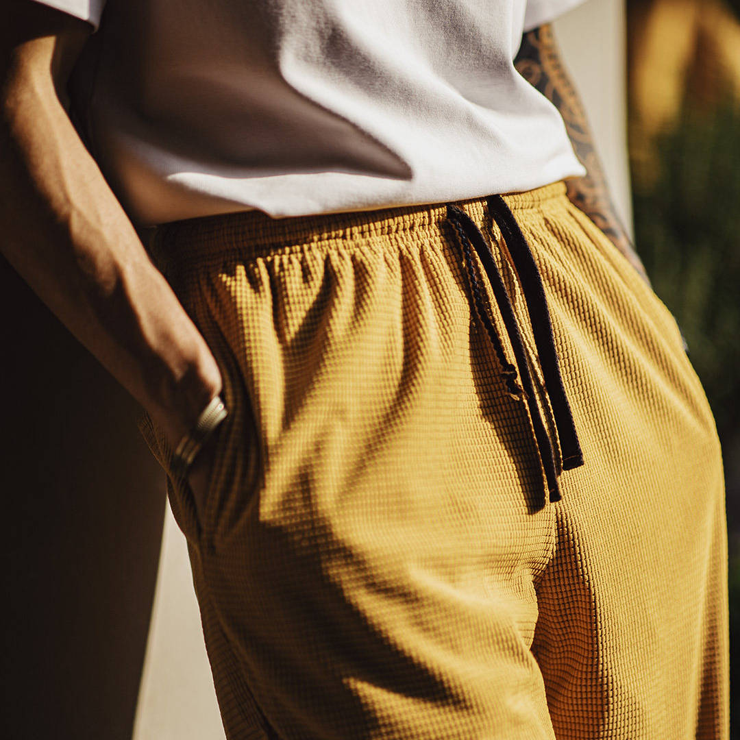 美式方格黃色玉米絨休閒褲直筒抽繩束脚寬鬆長褲子男款春