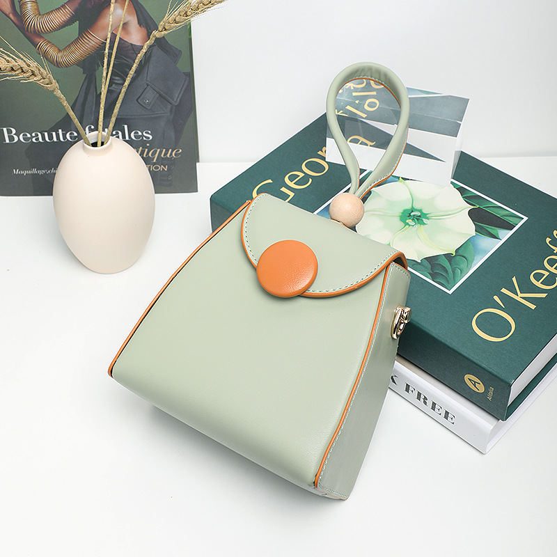 春夏撞色手提斜跨粽子包