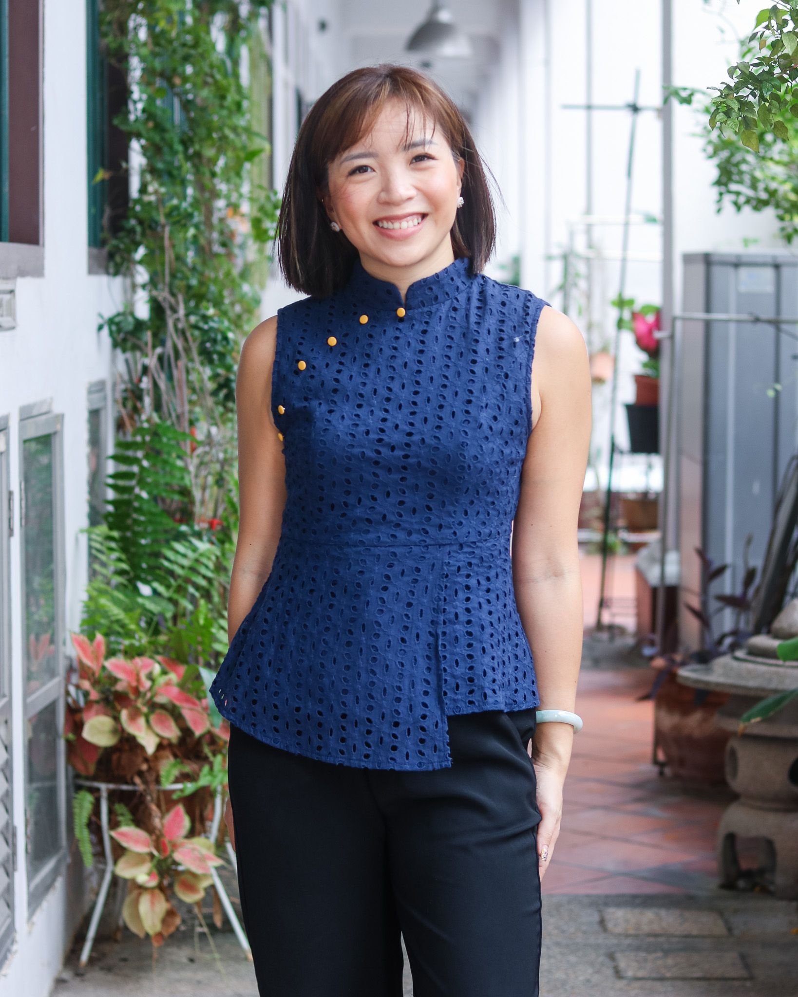 Trisha Eyelet Peplum Top in Navy