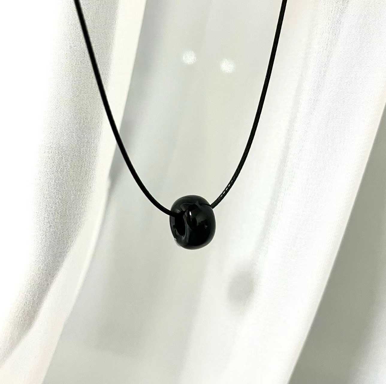 FLOSSY RING PENDANT STRING NECKLACE
