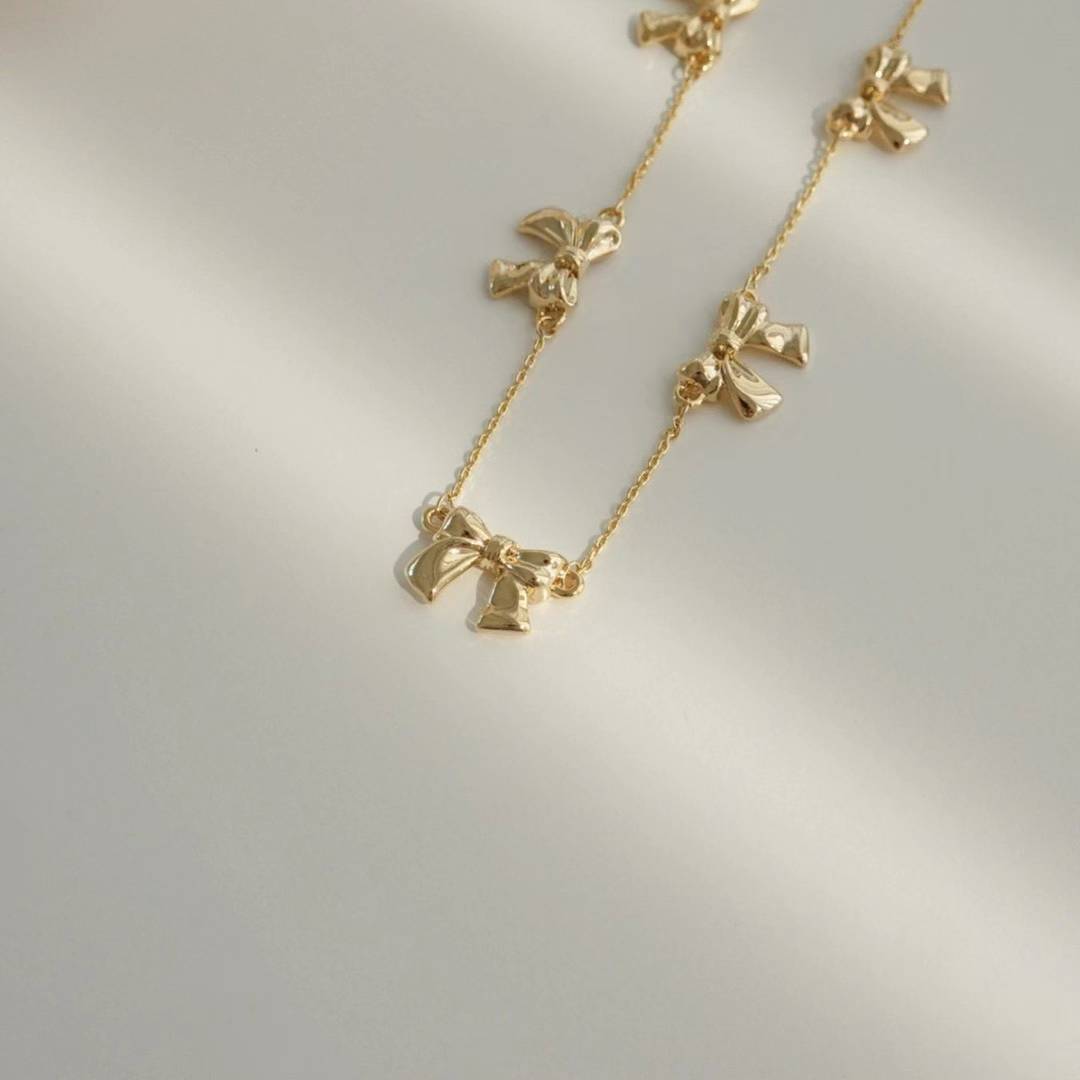 Zadie metal bows segmented necklace