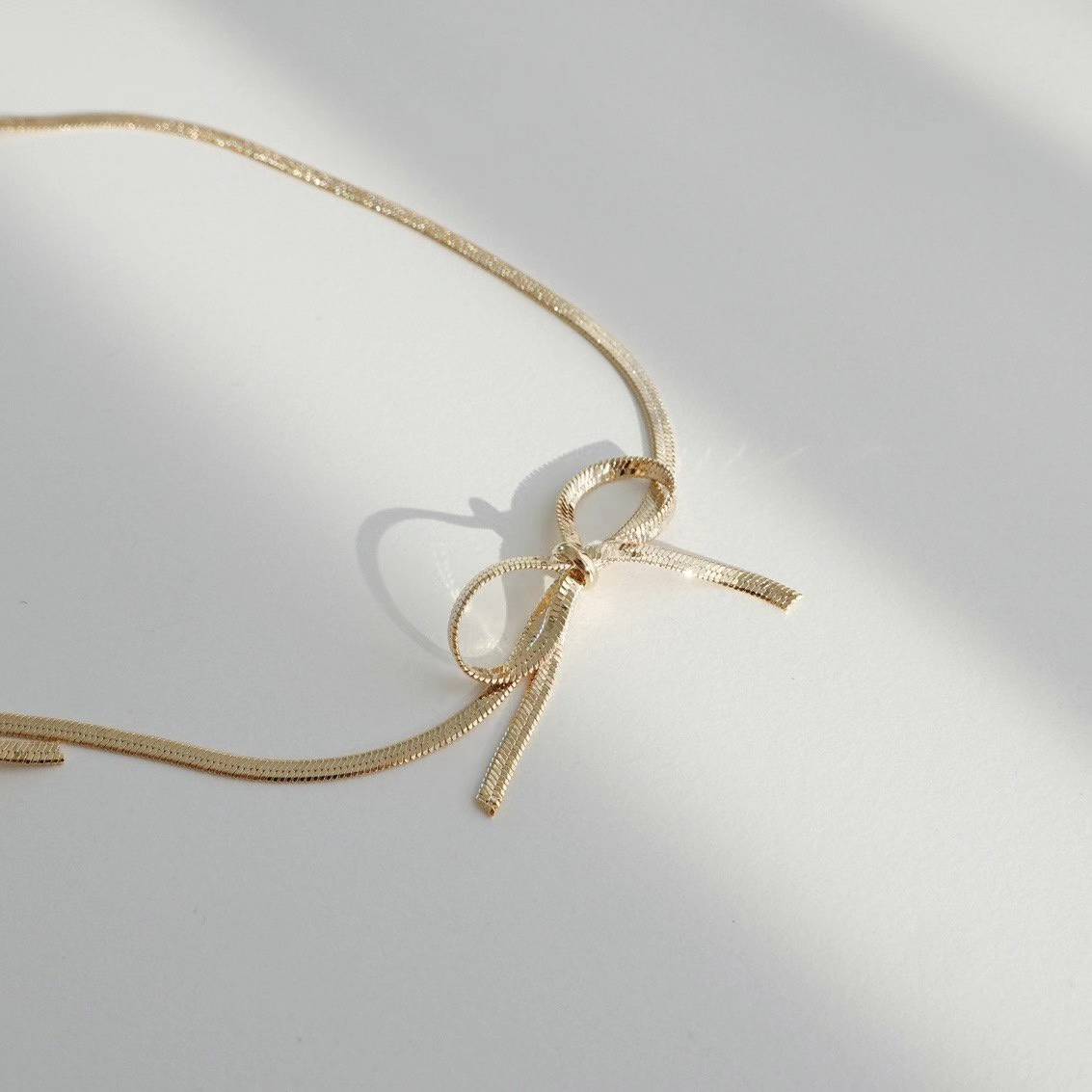 Bartha segmented bows necklace