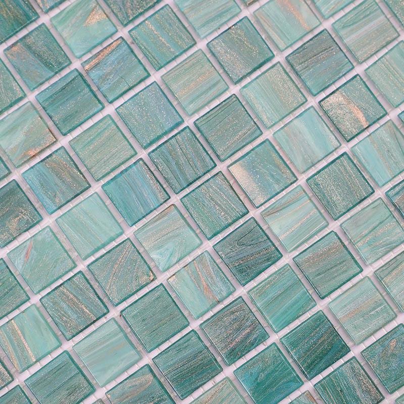 Close-up of 20mm light blue-green mosaic tiles with gold lines and elegant texture.