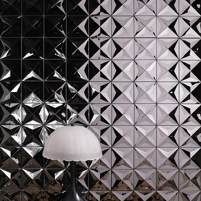 3D black metal flash mosaic tiles for walls, with black and white table lamp.