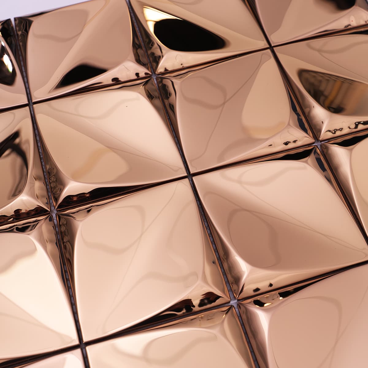 High-gloss rose gold 3D tiles with pyramid surface detail