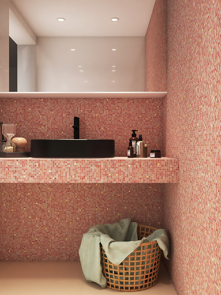 The pink mosaic tiles on the bathroom sink wall add a charming touch, beautifully paired with a bold black sink for a stylish contrast