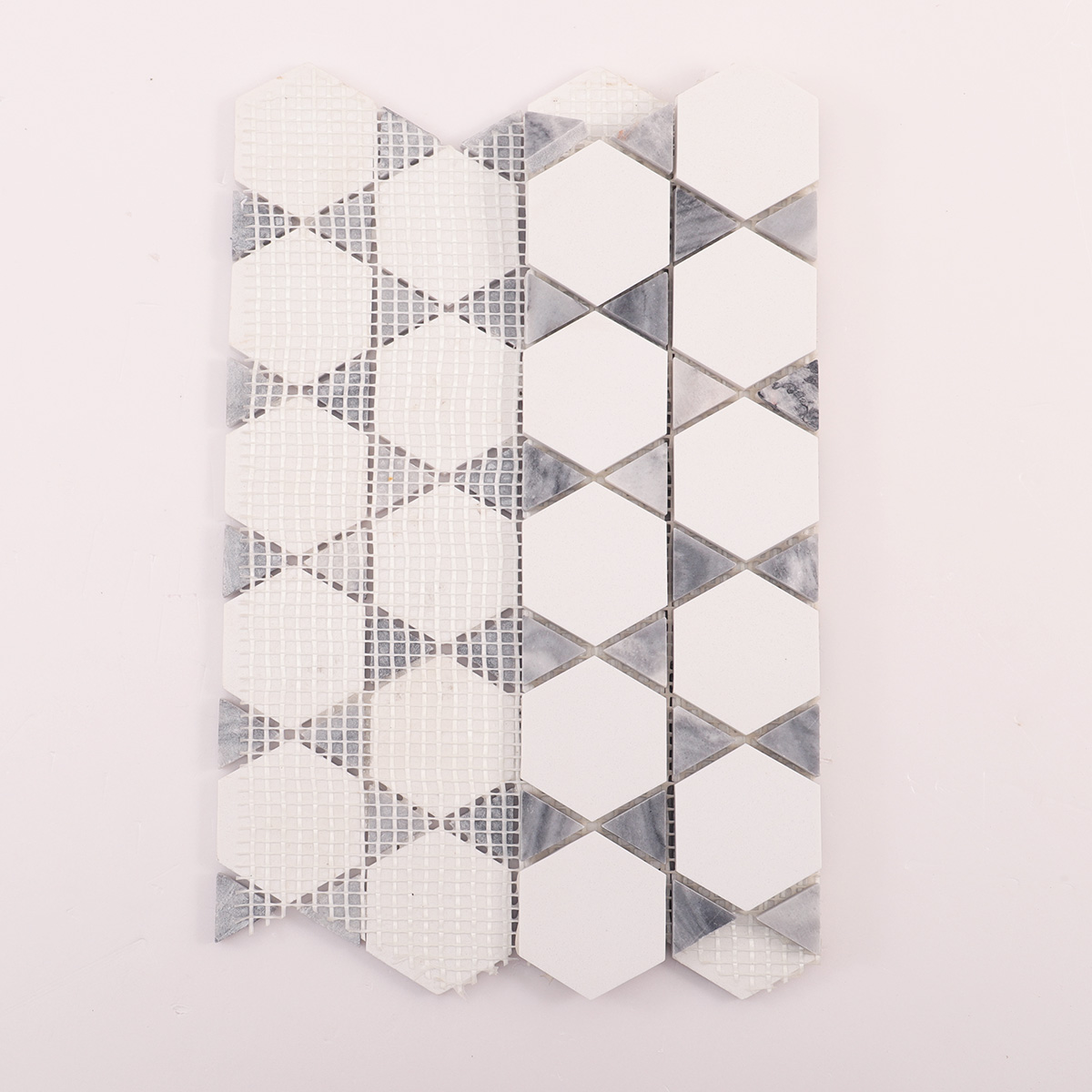 Folded back side of hexagon mix triangle marble mosaic tiles.