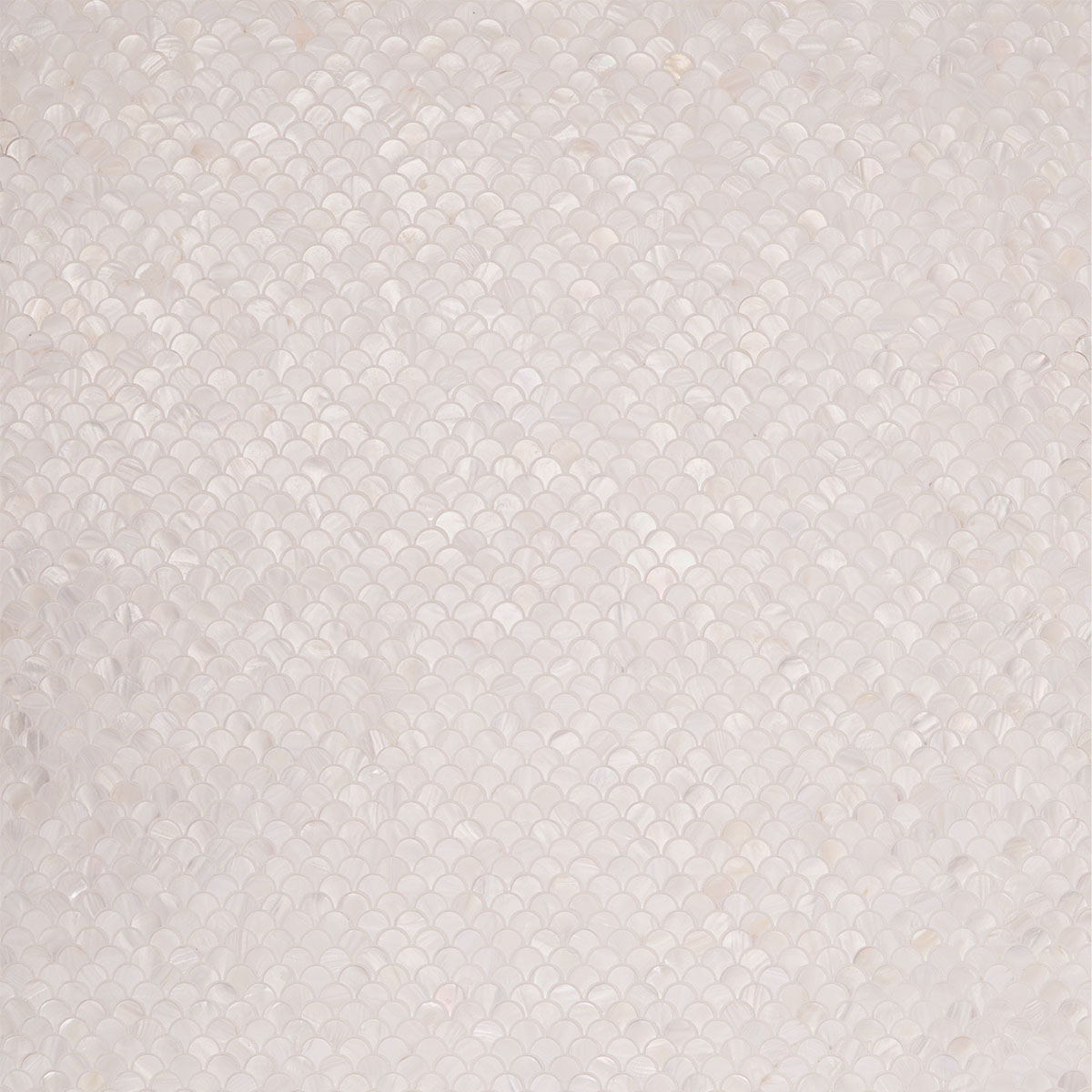 White fish scale mother of pearl mosaic tiles in a staggered pattern