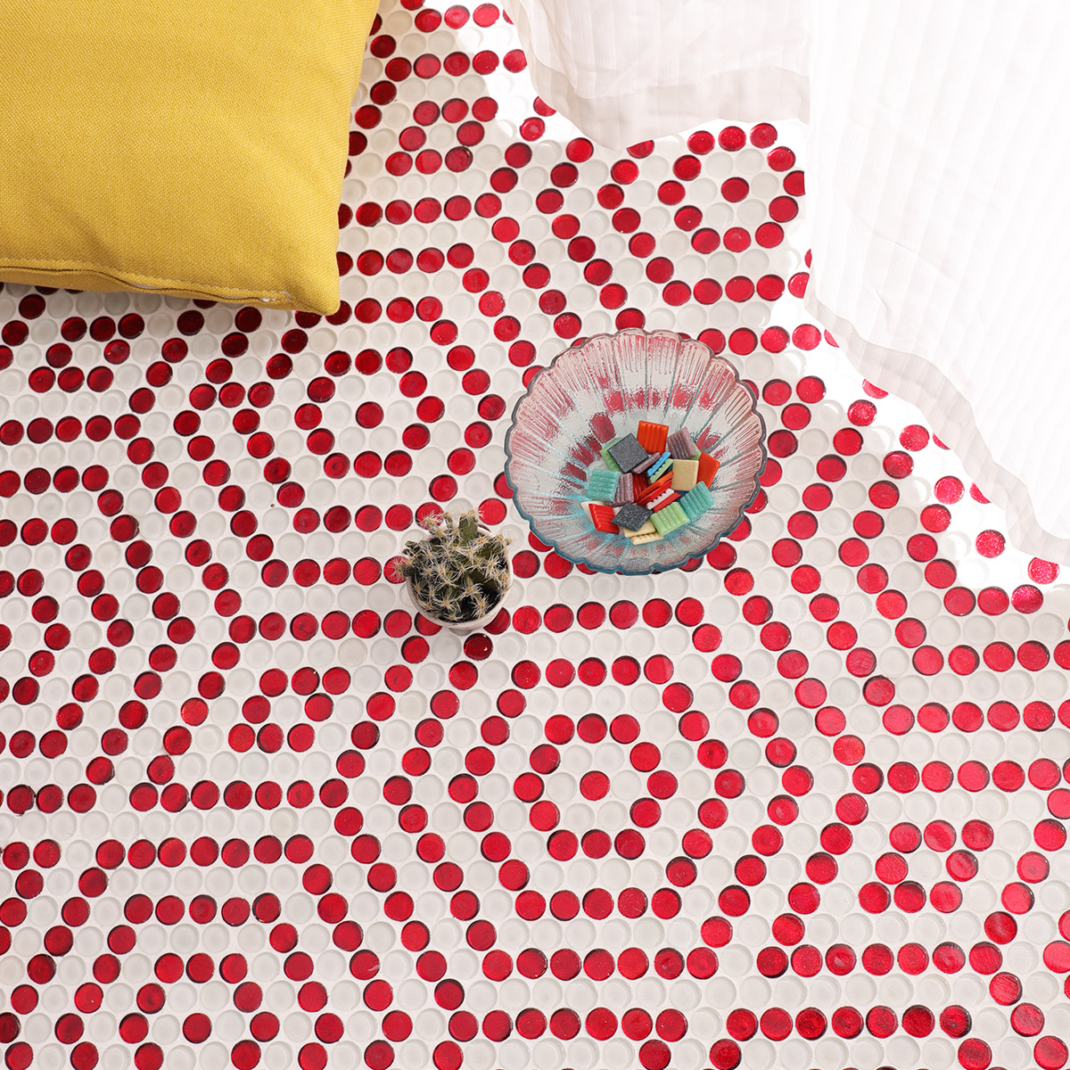 Ground scene featuring red and white hexagonal mosaic pattern