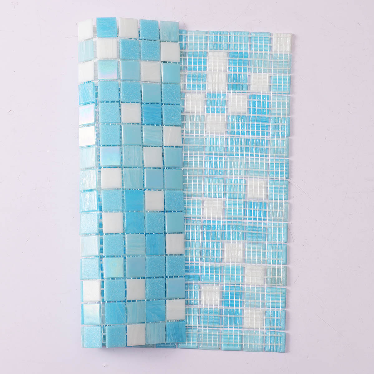 Back side of glossy aqua blue glass mosaic tiles, folded