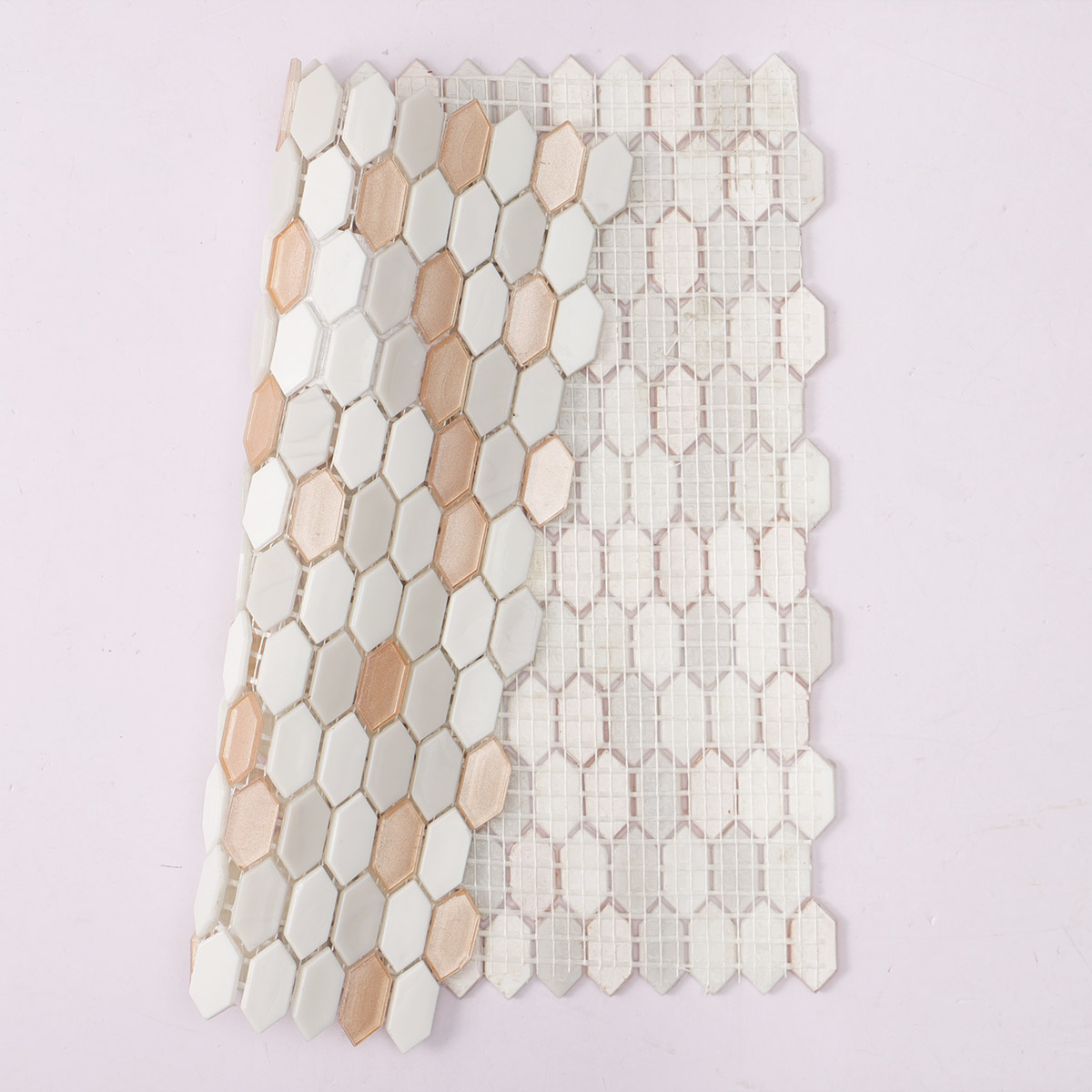 Back side of beige mixed fired earth glass mosaic picket tiles, folded.
