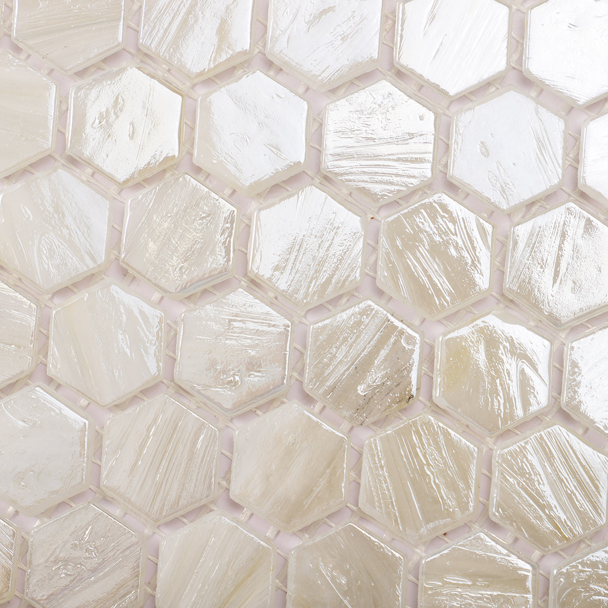 Close-up of beige flash hexagon glass mosaic tiles.