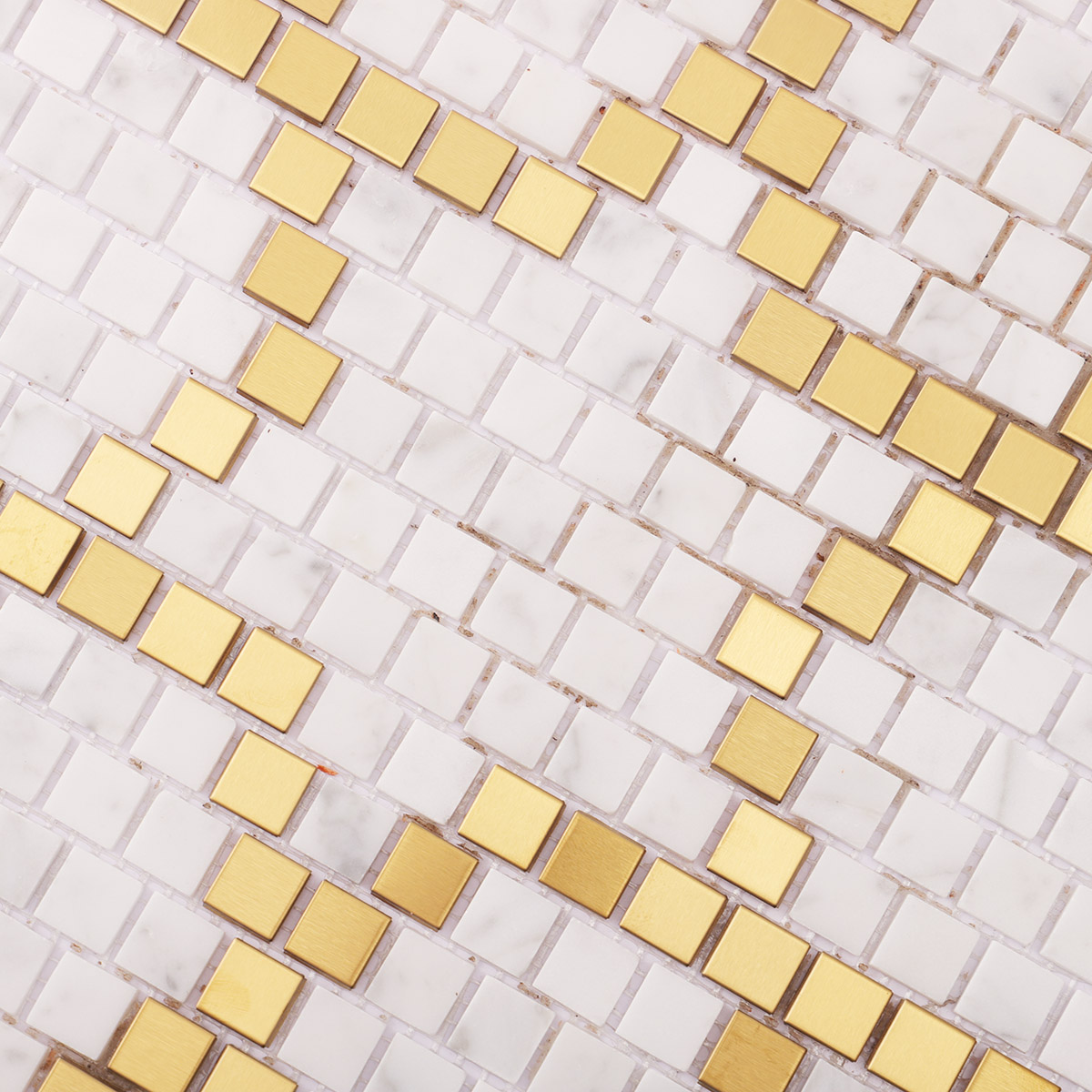 Close-up of metal and white marble pixel art mosaic tiles