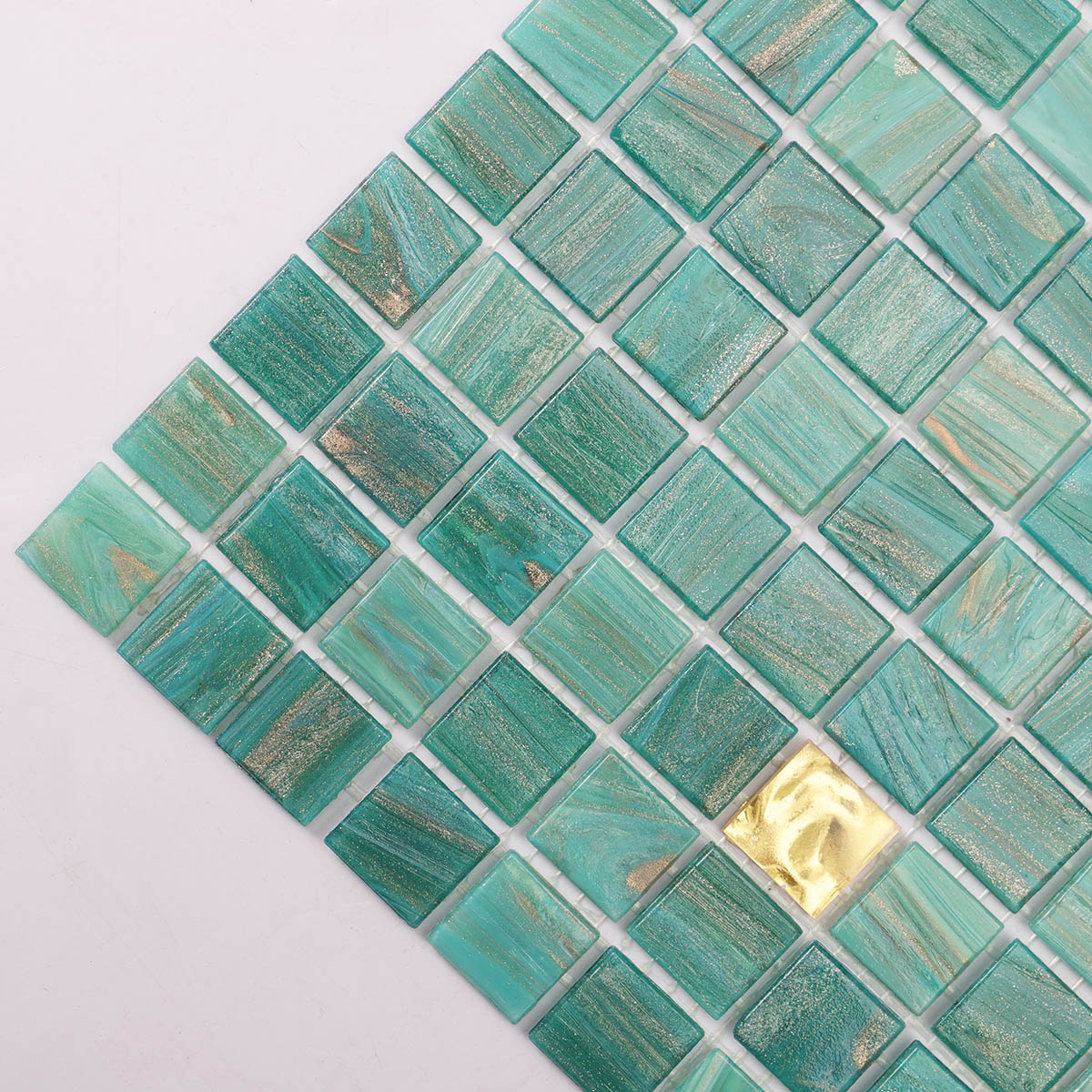 Side close-up of green and gold glass mosaic tiles
