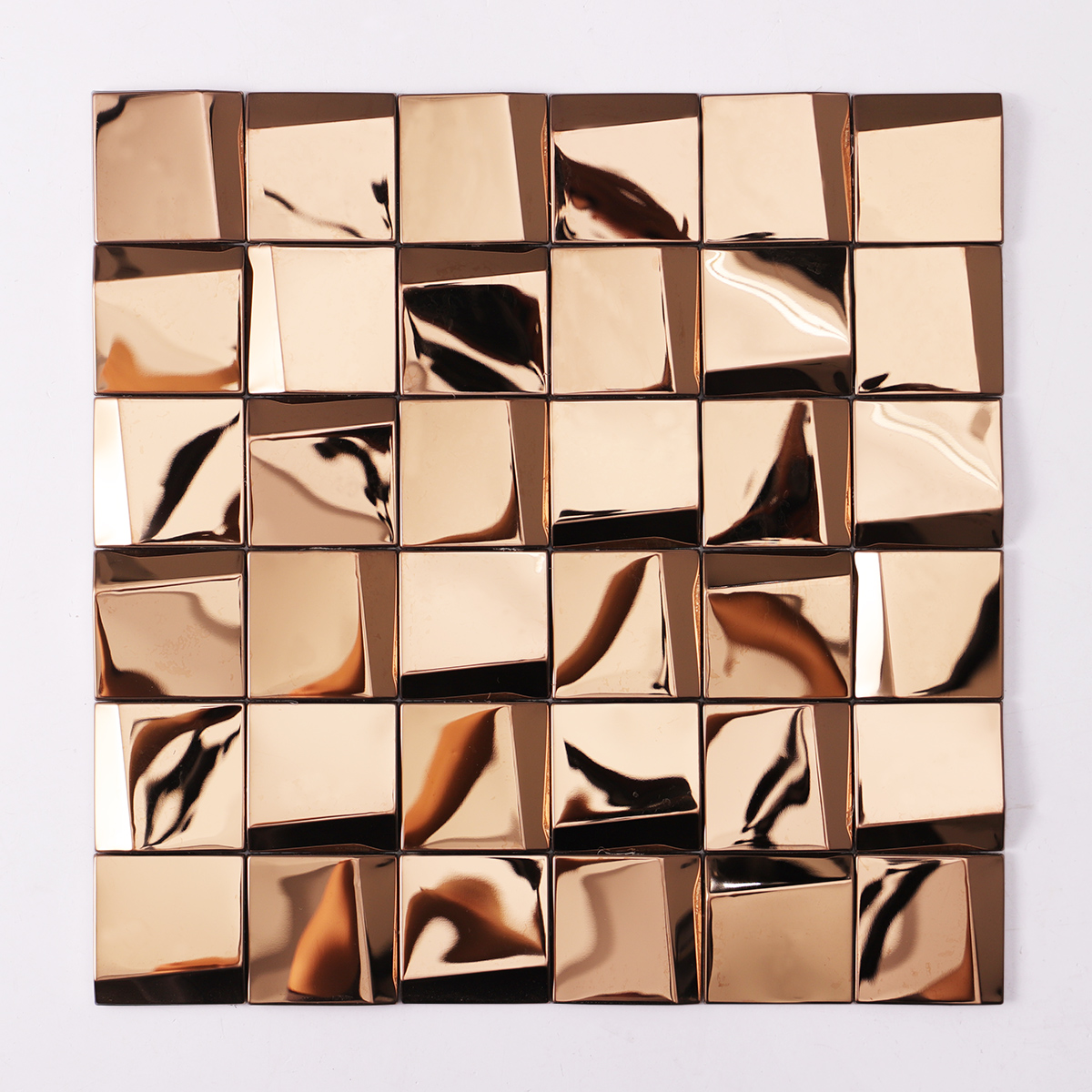Obverse side of mirror gold metal square mosaic tiles.