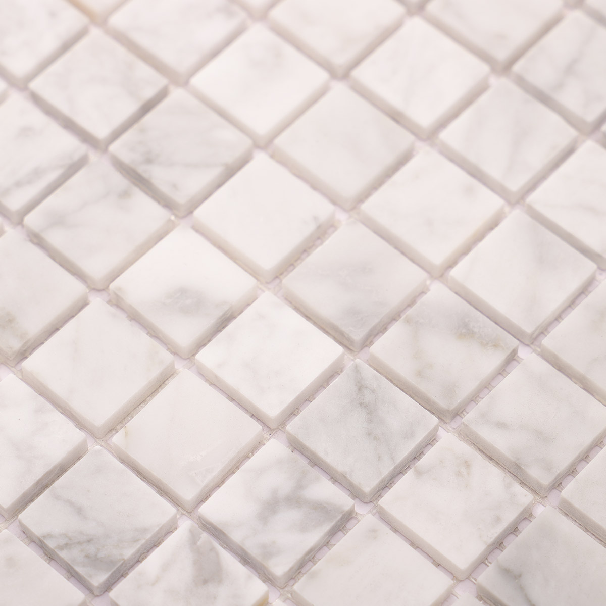 Detailed close-up of White Carrara square marble mosaic stone tile
