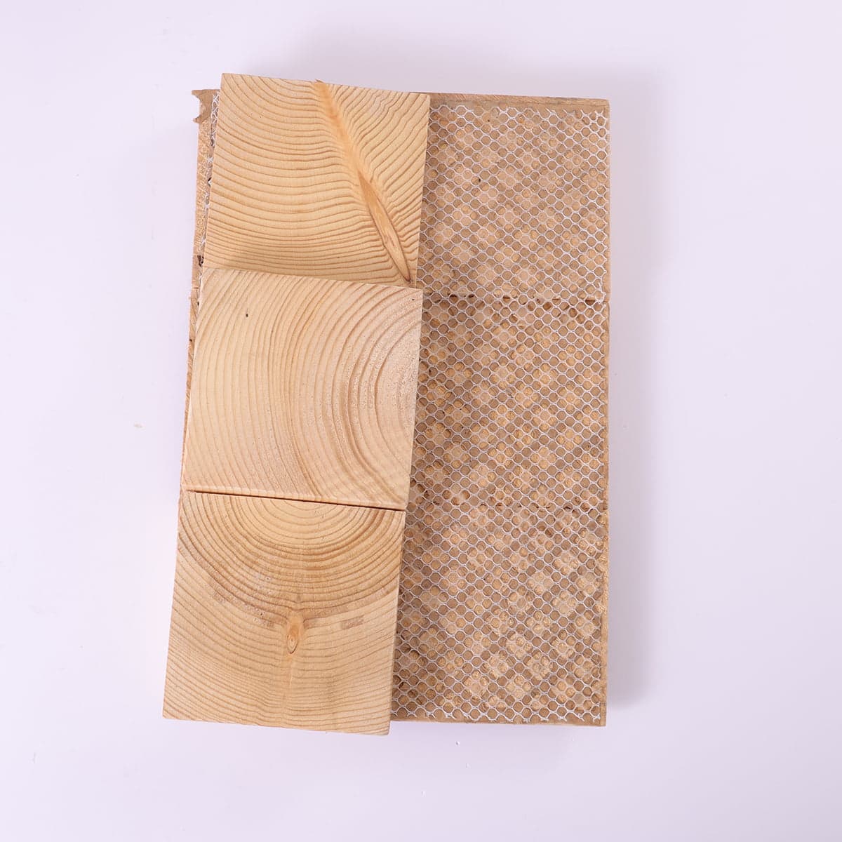 Back view of wood mosaic tile showing mesh backing