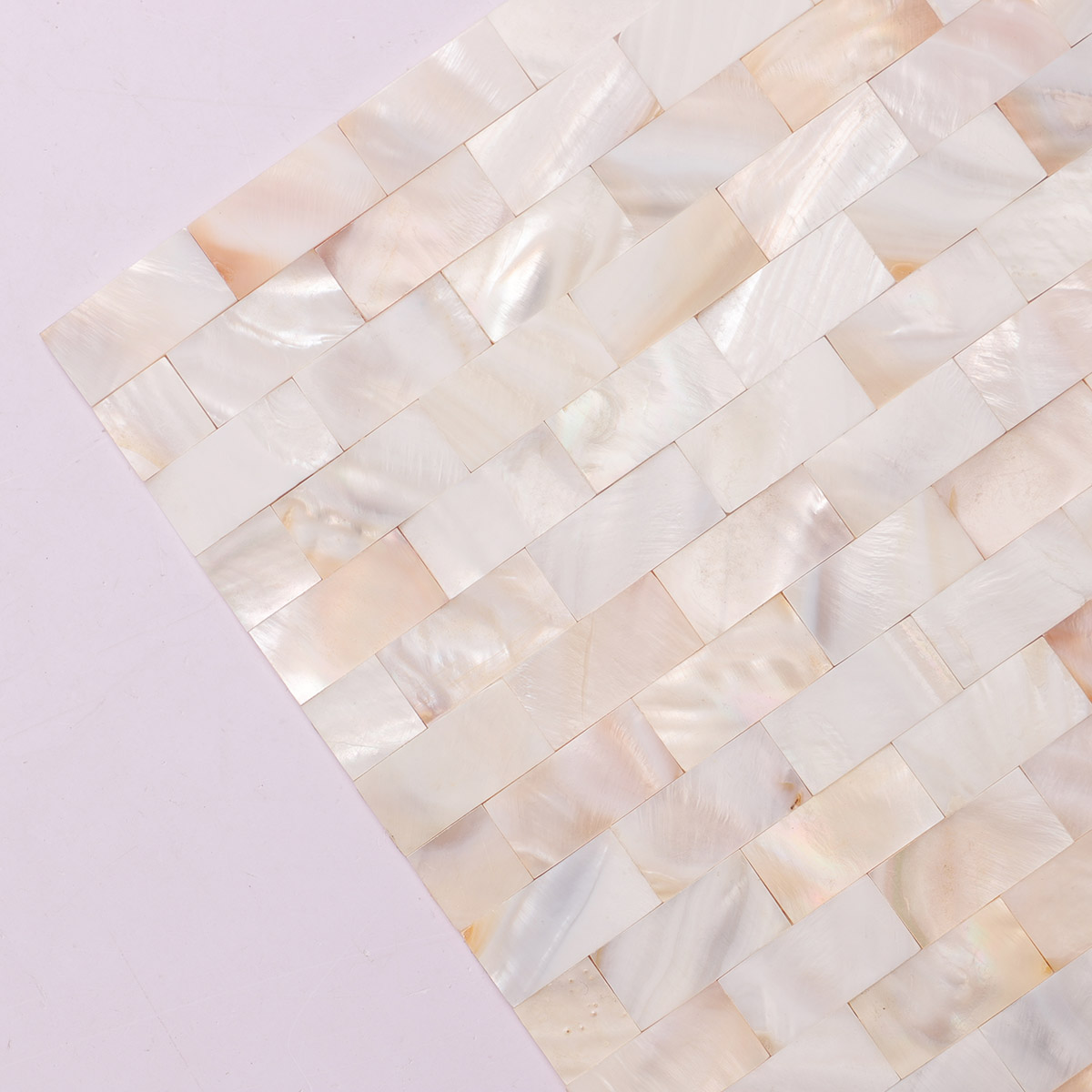 Close-up of tight joint mother of pearl subway mosaic tiles