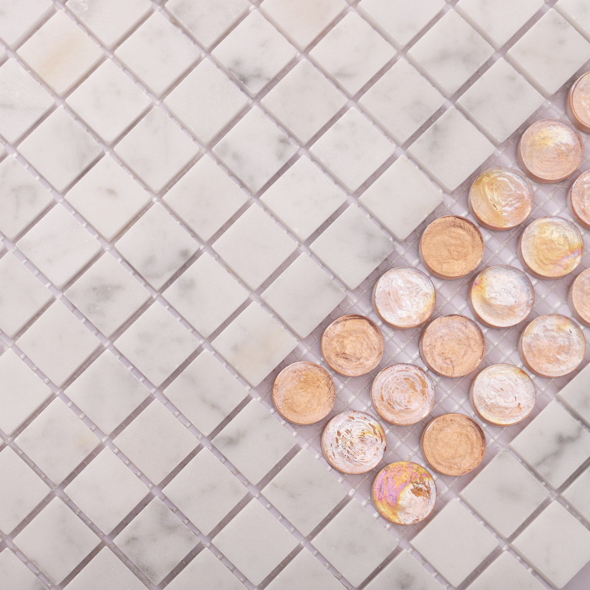 Close-up of white marble mixed with orange glass mosaic tiles