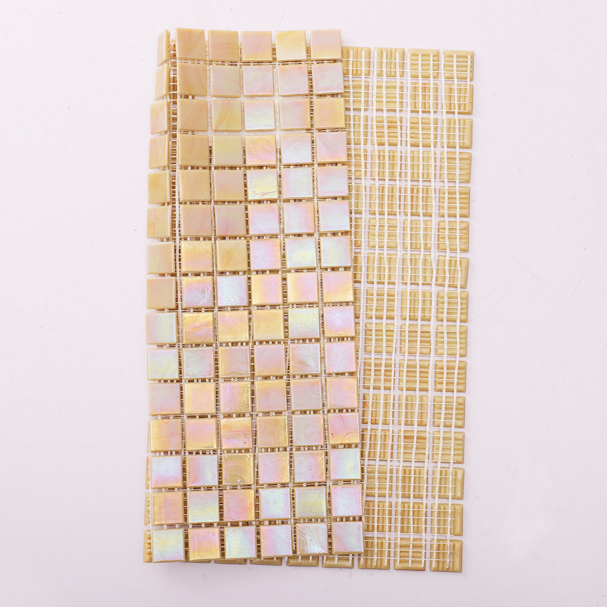 Folded back side of pearlescent bright yellow square glass mosaic tiles