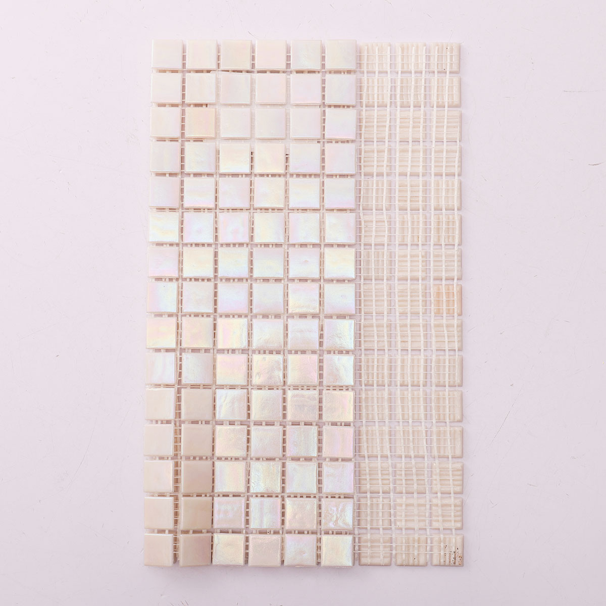 Back side of pearly iridescent pink square glass mosaic, folded