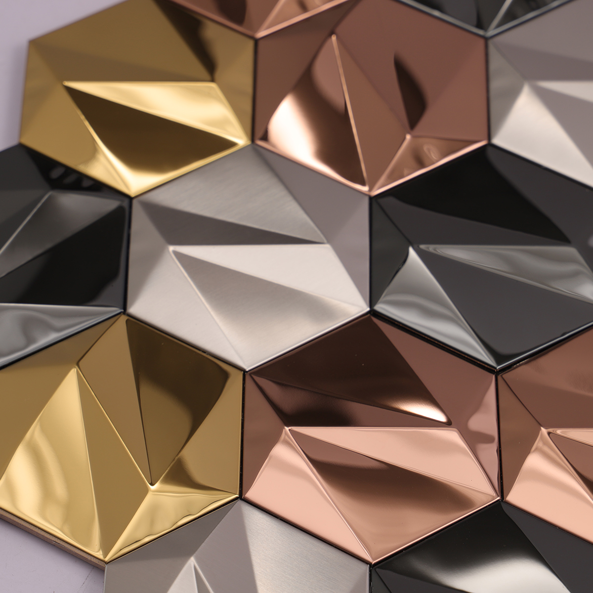 Close-up of 3D hexagon metal mosaic wall tiles