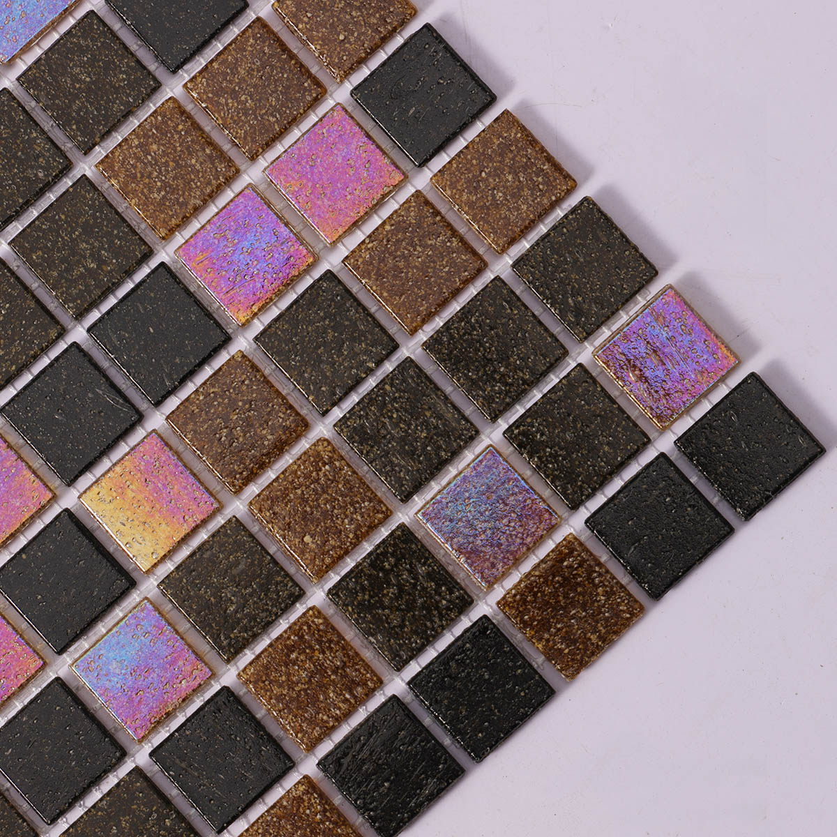 Side close-up of brown and black mixed square glass mosaic tiles