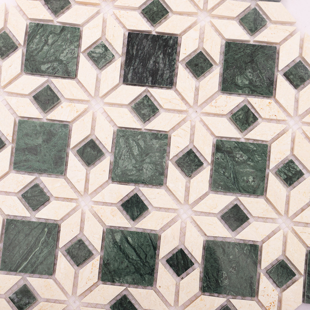 Close-up of green mixed beige marble mosaic natural stone tiles.