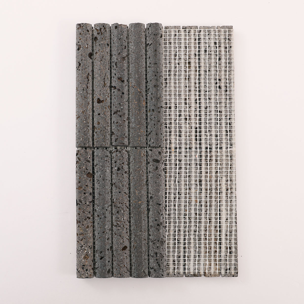 Folded back side of 3D concave fluted strip black lava stone mosaic tiles.