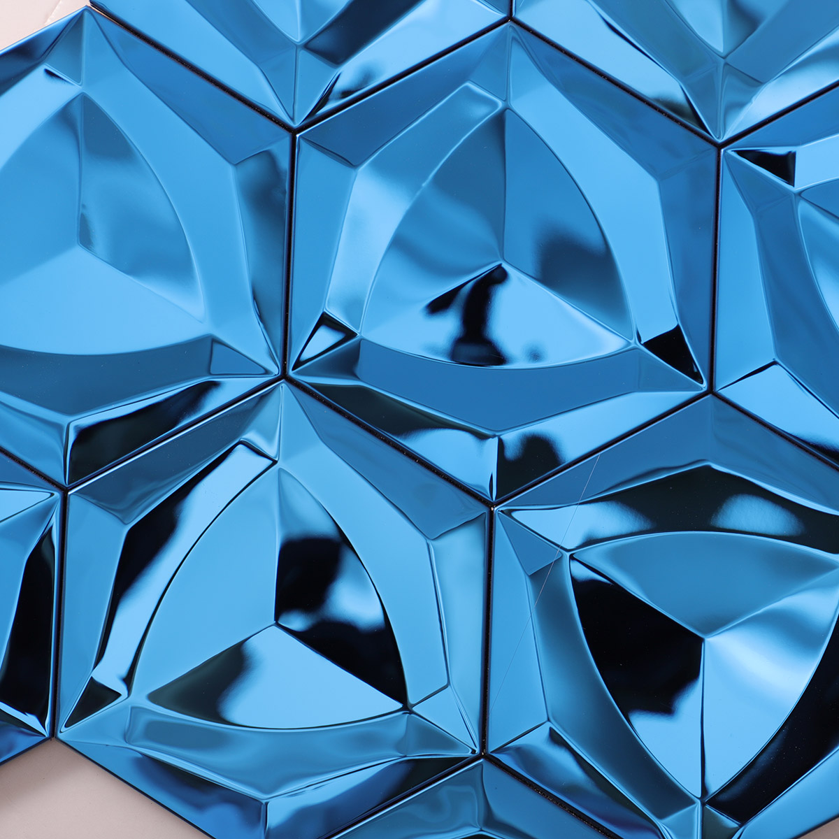 Close-up view of 3D blue hexagon stainless steel mosaic tiles.