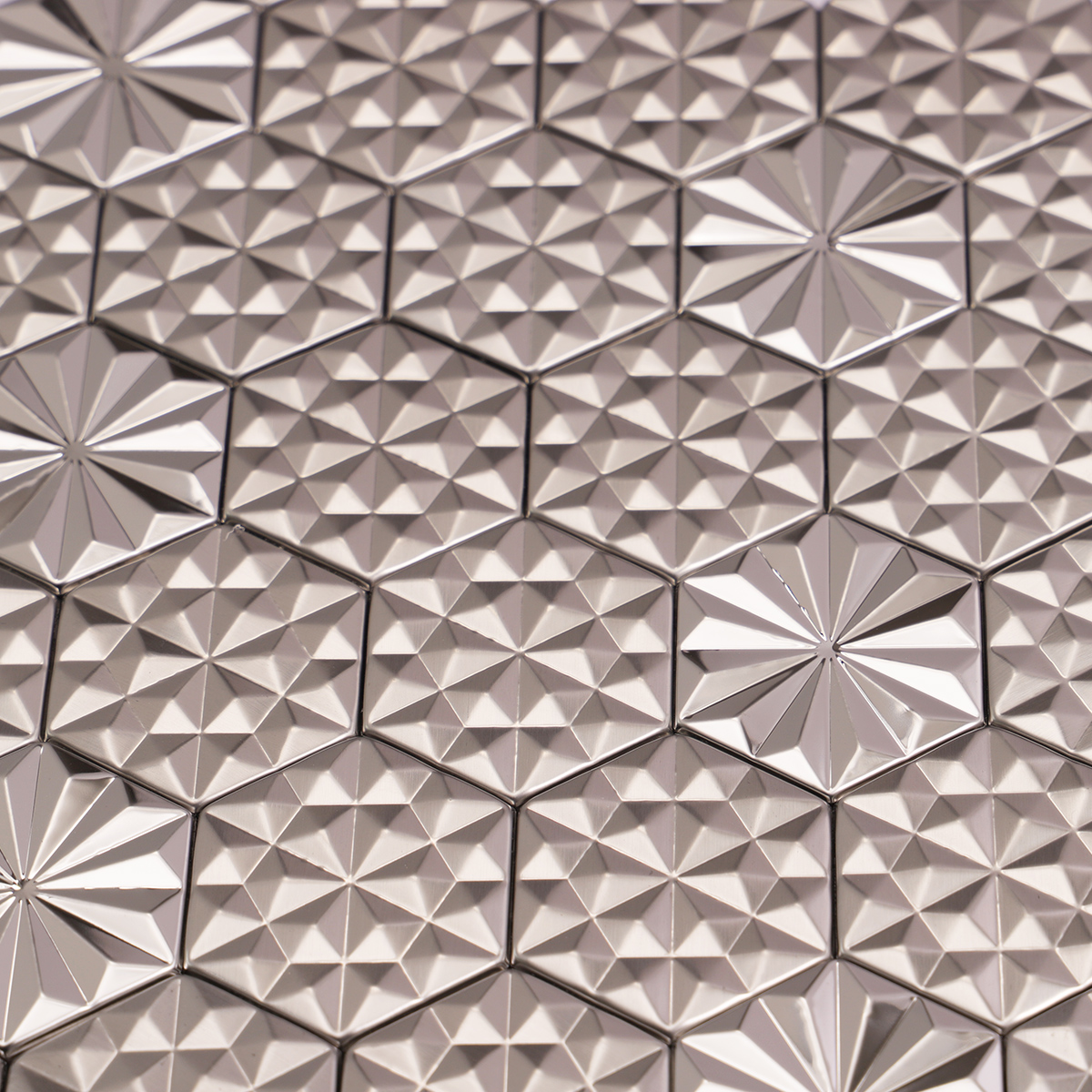 Close-up of silver hexagon 3D metal mosaic tiles.
