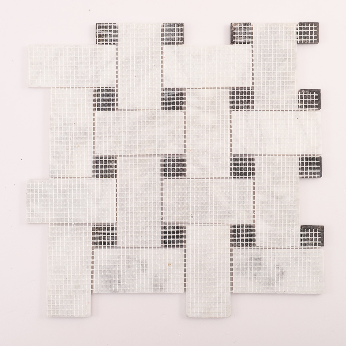 Back side of Carrara white basketweave marble mosaic tiles