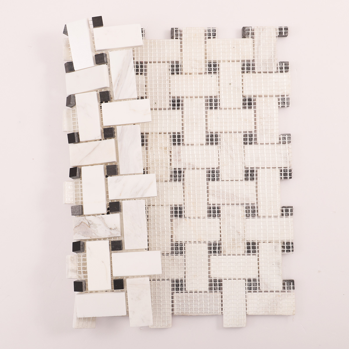 Folded back side of white basketweave marble mosaic tiles