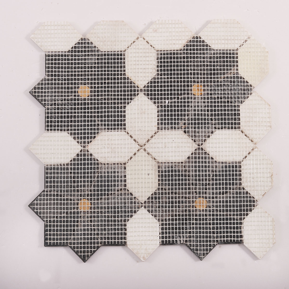 Back side of white and black floral marble mosaic tiles