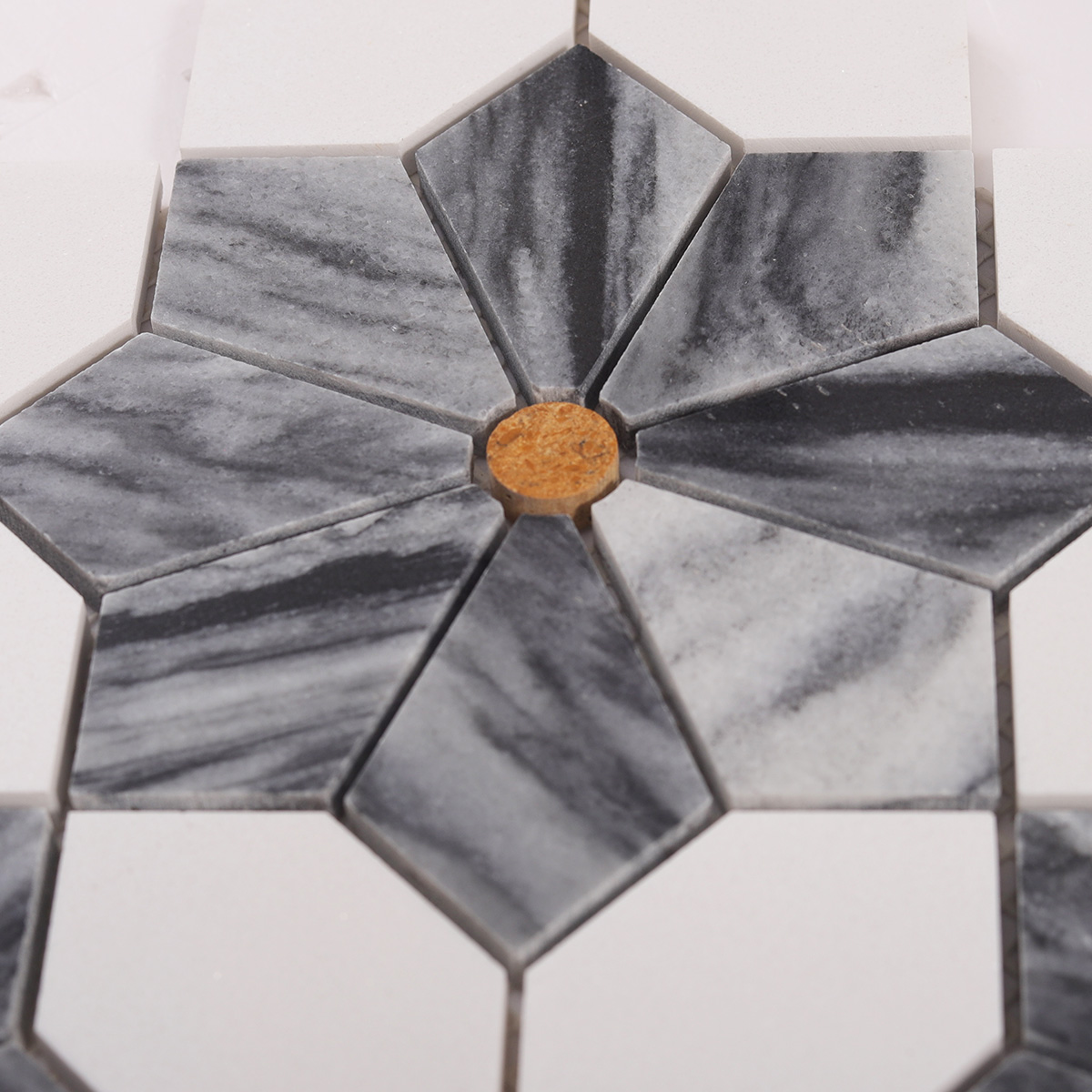 Detailed close-up of gray & white flower marble mosaic tiles