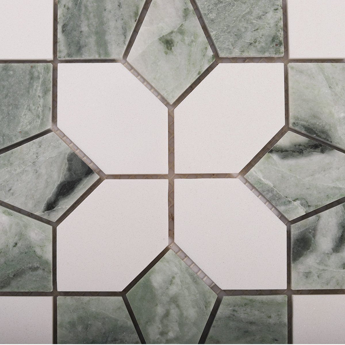 Close-up of Ming green and white floral marble mosaic tiles