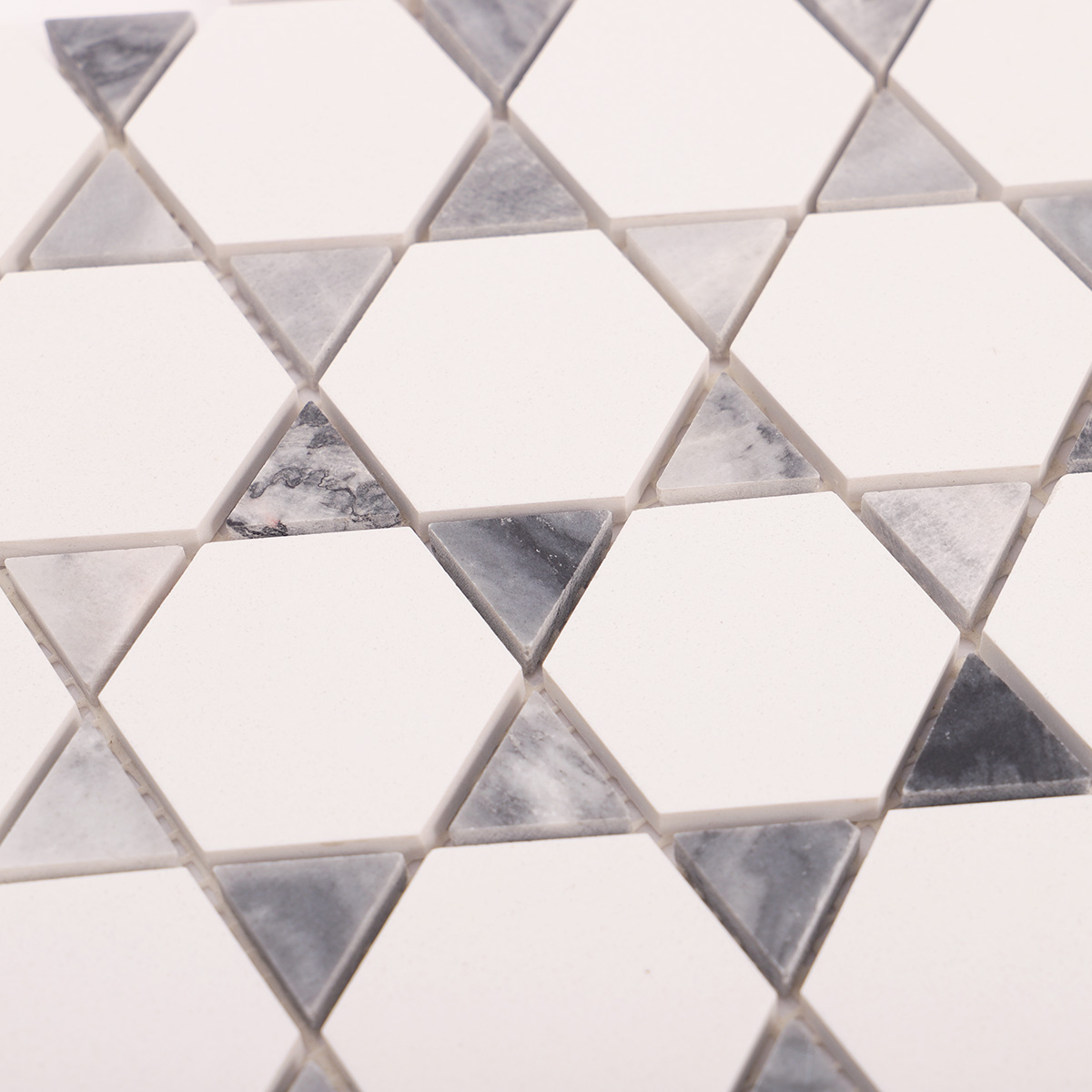 Close-up view of hexagon mix triangle marble mosaic tiles.