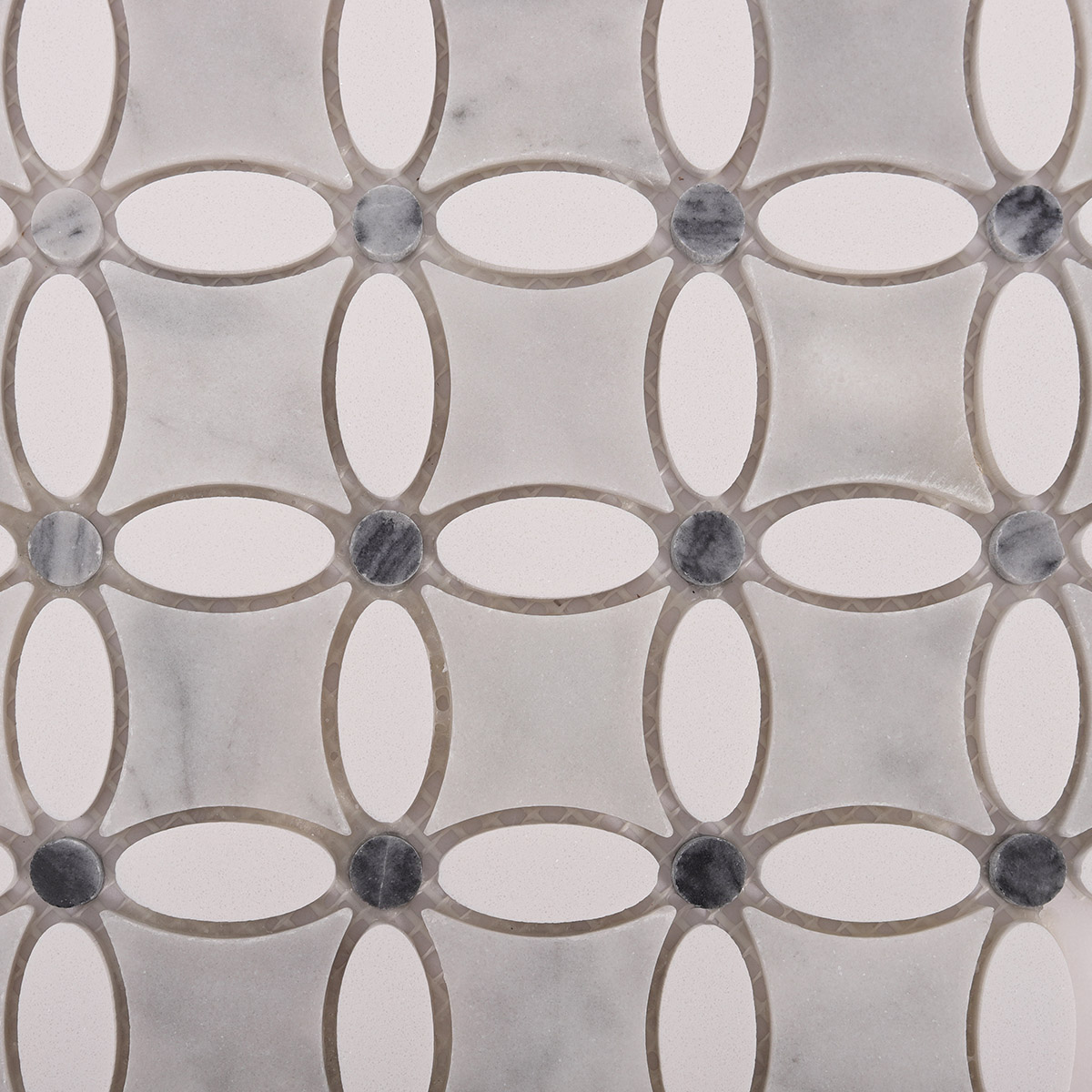 Close-up of thassos gray and white floral marble mosaic tiles