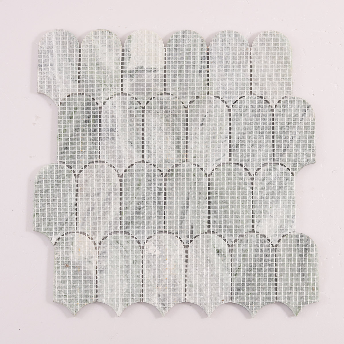 Back side of Envy Green long fish scale marble mosaic tiles