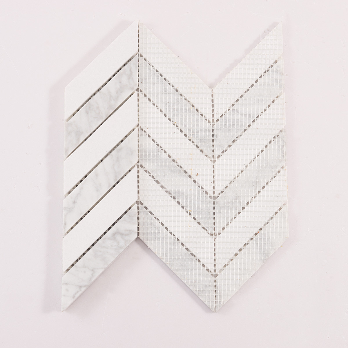 Back side of Herringbone Carrara White marble mosaic tiles, folded