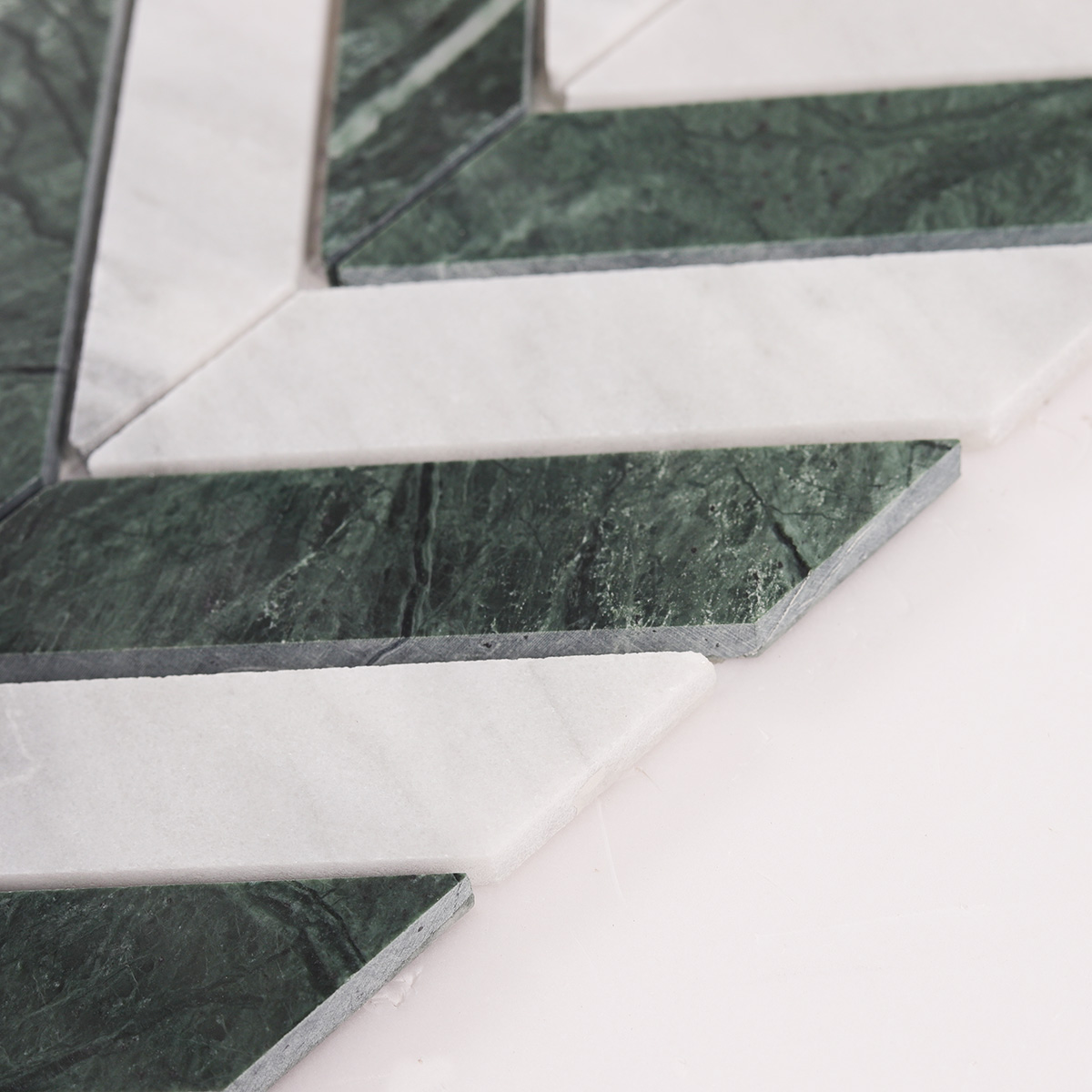 Side close-up view of Green & White Herringbone Honed marble mosaic tiles