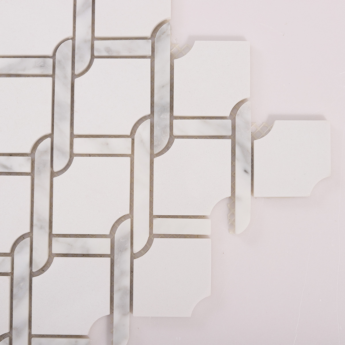 Detailed close-up of White Fog Chain Link stone mosaic tiles