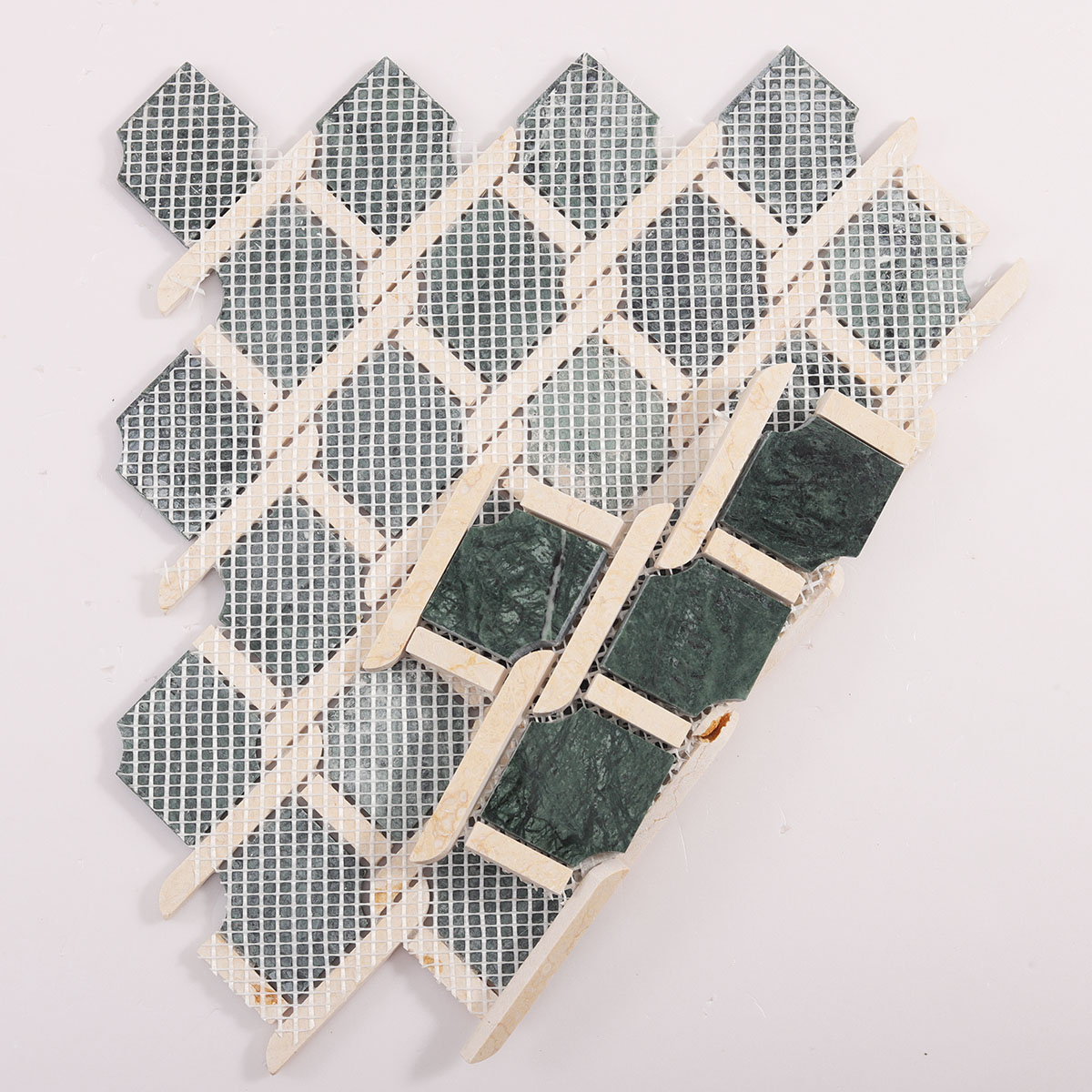 Folded back side of Rockart Medallion Green polished marble mosaic tiles.