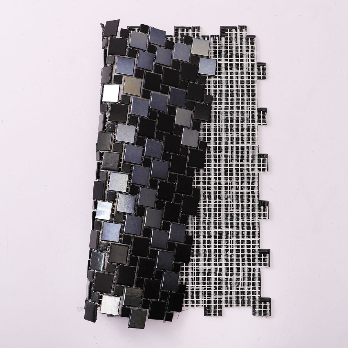 Windmill Pattern Black Glass Mosaic Tile, back side with fold visible, sturdy construction