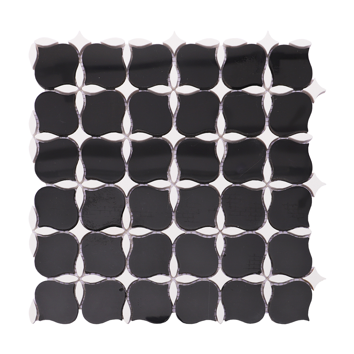 Full view of black and white stone mosaic tile with a unique floral design and glossy finish