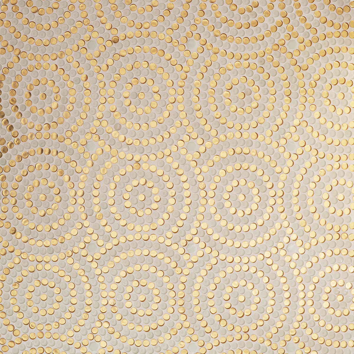  Close-up detail image of the smooth surface of the circular gold and white mosaic tile